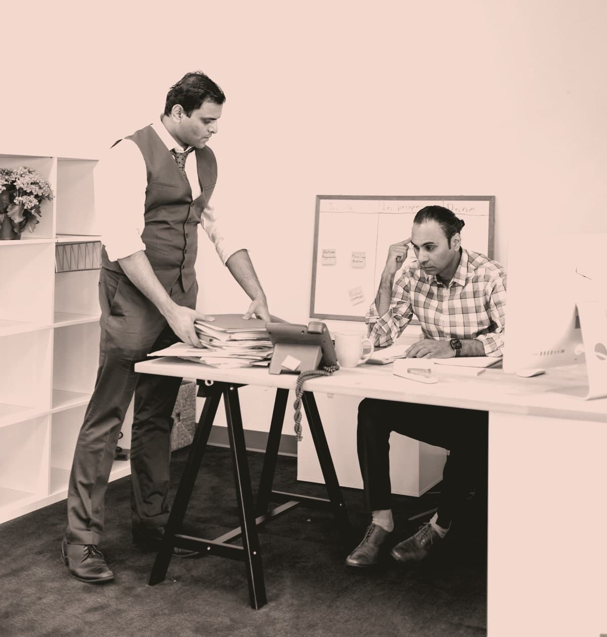 Handing off a shortlist at the desk